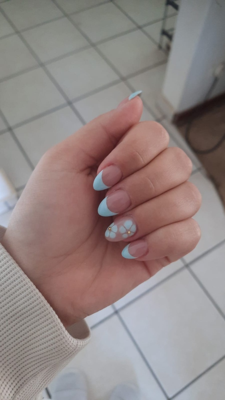 Sky-blue floral French nail design by Nails by B